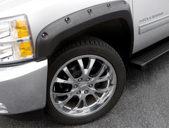 Lund 16-17 Nissan Titan XD RX-Rivet Style Smooth Elite Series Fender Flares - Black (4 Pc.)